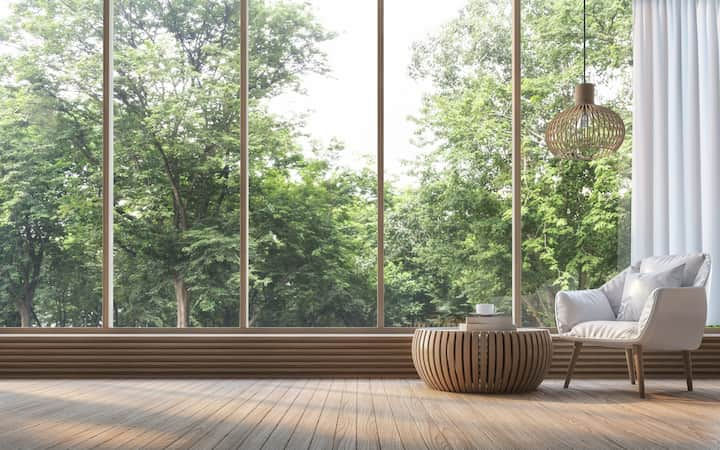 Modern living room window installation gives views of nature